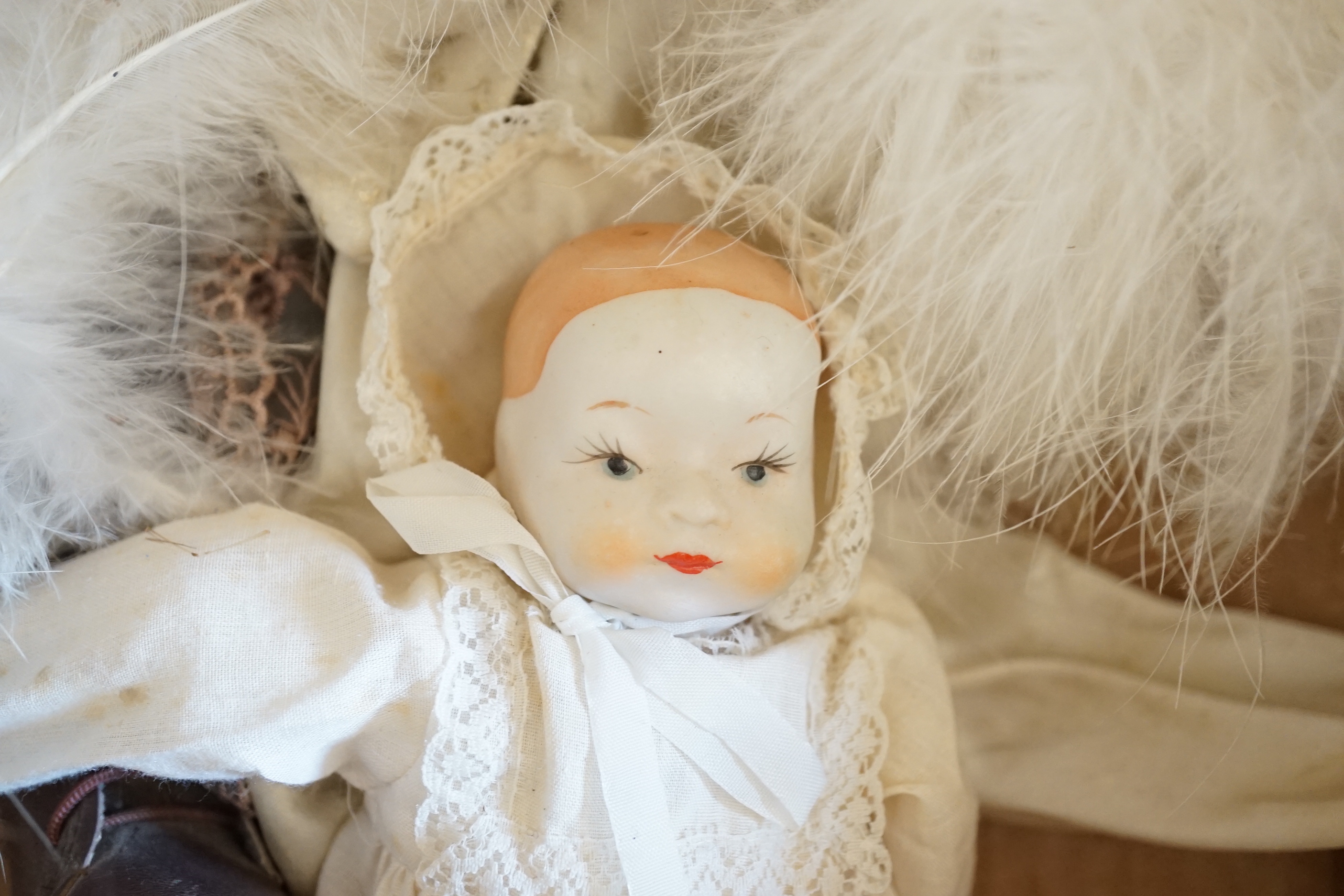 Four modern bisque dolls, largest 56cm